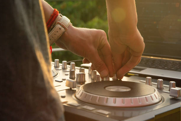 istock Dj mixing music outdoor. 694156552