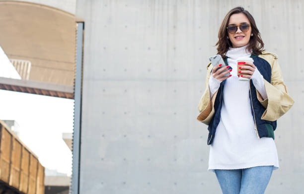 istock Woman drinking coffee outside 694156560