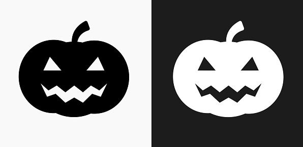 Halloween Pumpkin Face Icon on Black and White Vector Backgrounds. This vector illustration includes two variations of the icon one in black on a light background on the left and another version in white on a dark background positioned on the right. The vector icon is simple yet elegant and can be used in a variety of ways including website or mobile application icon. This royalty free image is 100% vector based and all design elements can be scaled to any size.