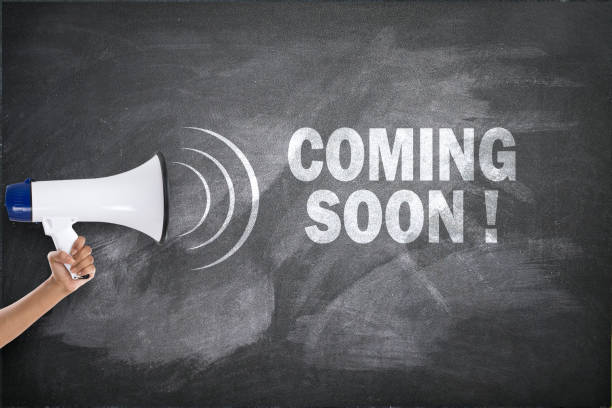 istock Megaphone with coming soon sign on blackboard 694163278