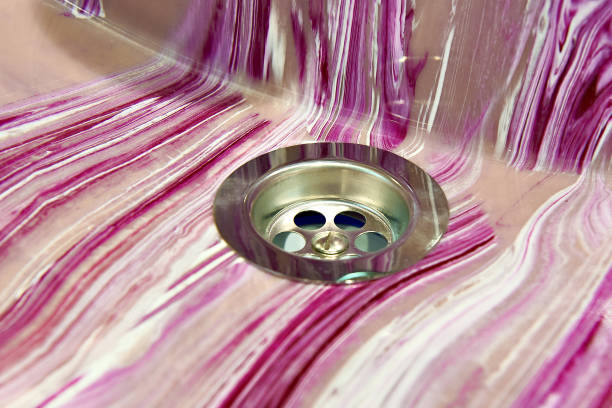 Holes for draining water in bathroom pink sink