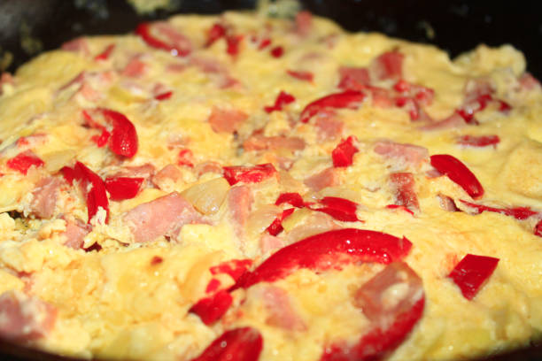 istock cooking of omelet with red paprika 694163684