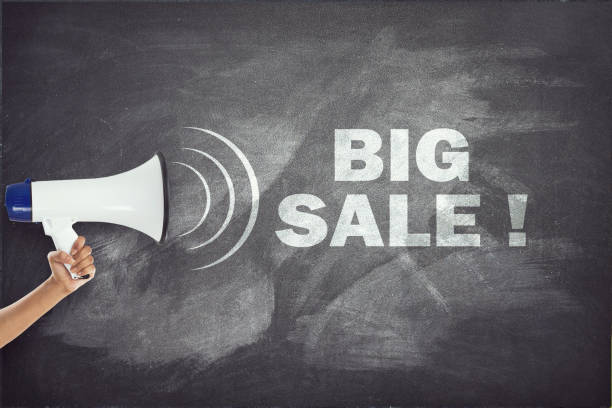 istock Megaphone with big sale sign on blackboard 694163722
