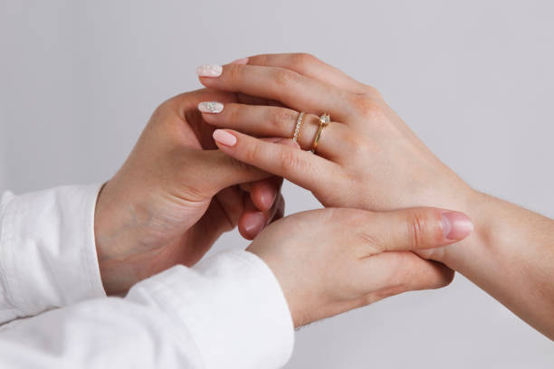 istock Bride wears a wedding ring to the groom 694167388