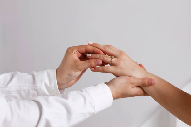 istock Bride wears a wedding ring to the groom 694167398