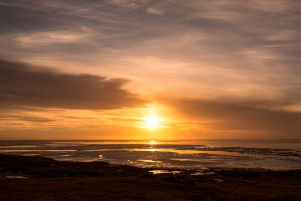 istock Sunset on iceland beach with beautiful sky 694167722