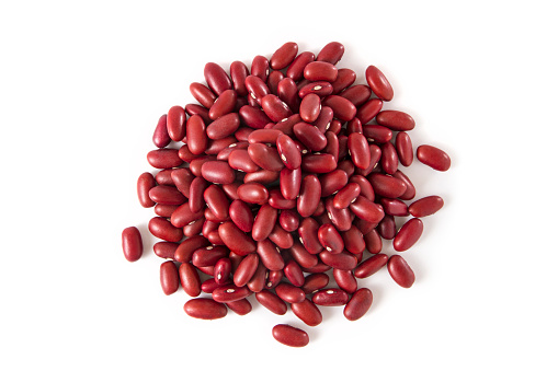 Heap of red beans from directly above on white background.
