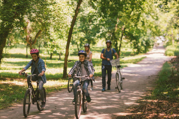 istock Family riding bicycle 694171592