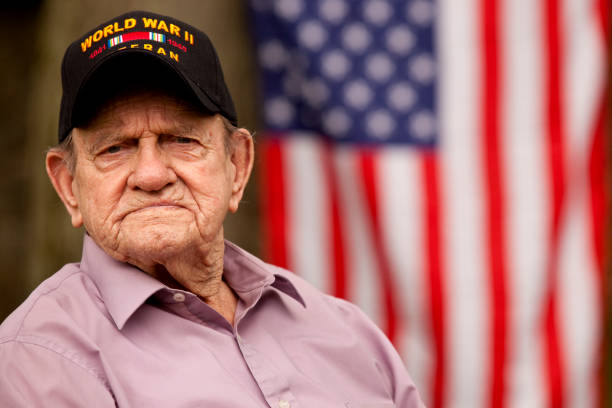 istock World War Two, Veteran wearing  baseball cap with text, 