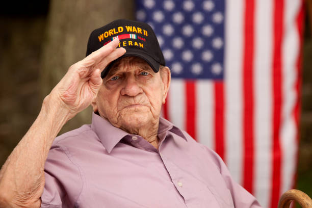 istock World War Two, Veteran wearing baseball cap with text, 