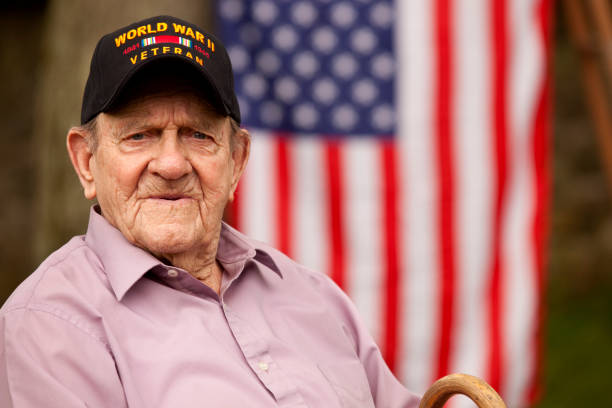istock . World War Two, Veteran wearing  baseball cap with text,