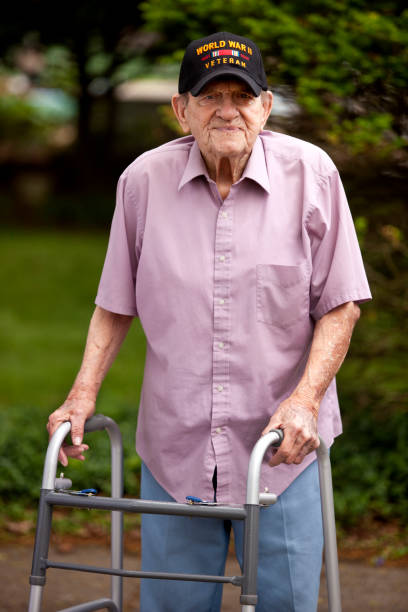 istock World War Two, Veteran wearing  baseball cap with text,