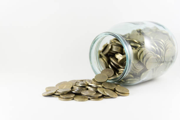 istock Money in a glass jar on a white background 694177856