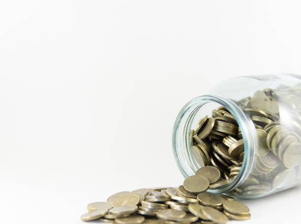 istock Money in a glass jar on a white background 694178114