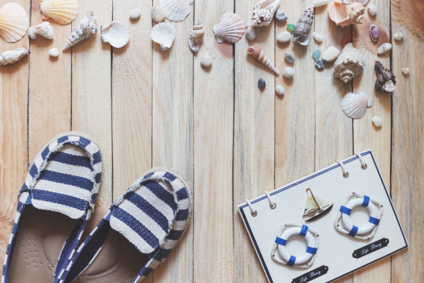 istock Striped espadrilles and marine decorations on the wooden background 694178122