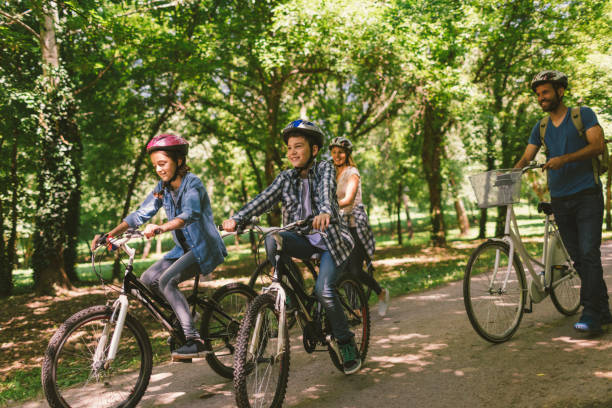 istock Family riding bicycle 694180272