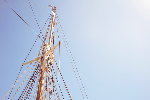 Detail of mast's ship on a sunny day with blue sky.