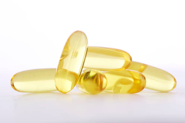 capsules d' - cod liver oil capsule vitamin pill vitamin e photos et images de collection