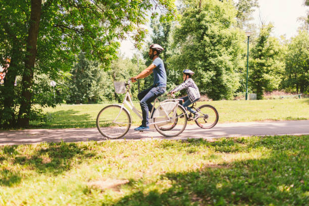 istock Family riding bicycle 694185260