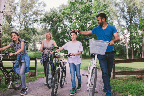 istock Family riding bicycle 694198494
