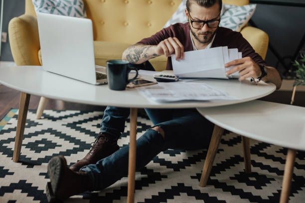 istock Young hipster going through household finances 694198604