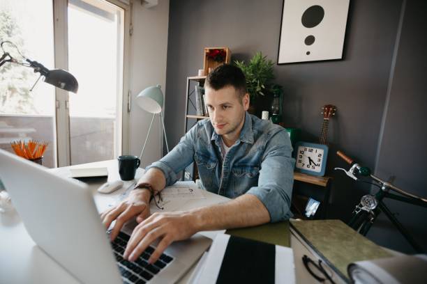 istock Young architect working in the office on the laptop 694199052