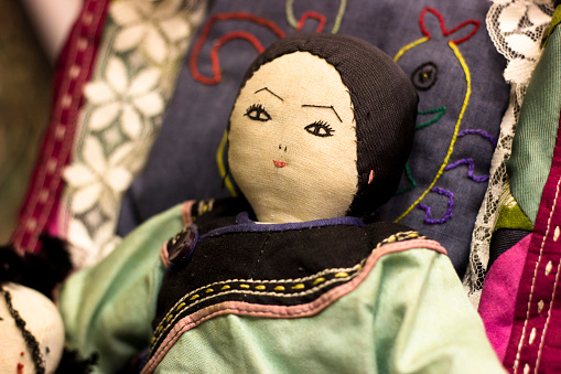 Traditional original syberian doll. Religious purpose puppet. Scary face of strange dummy. Shaman tool