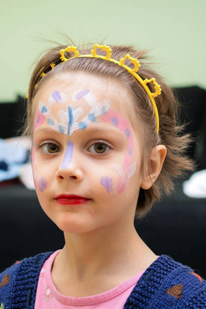 istock Little girl with face paint 694201866