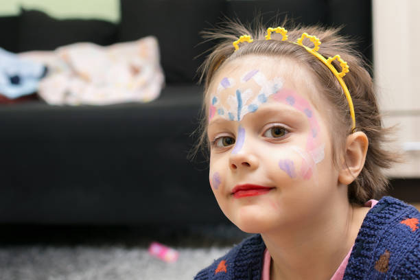 istock Little girl with face paint 694202082
