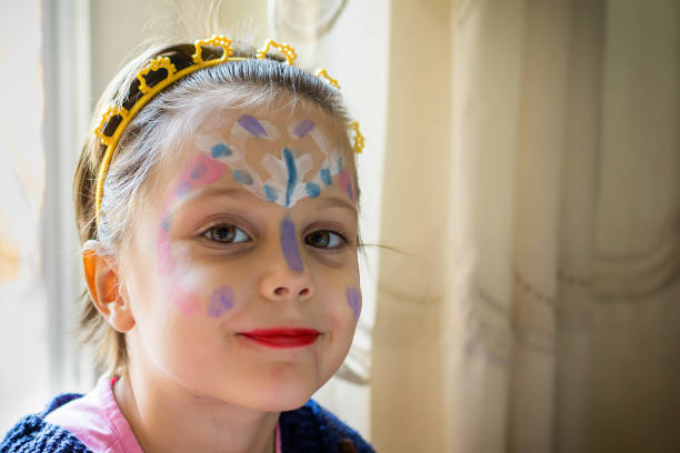 istock Little girl with face paint 694202088