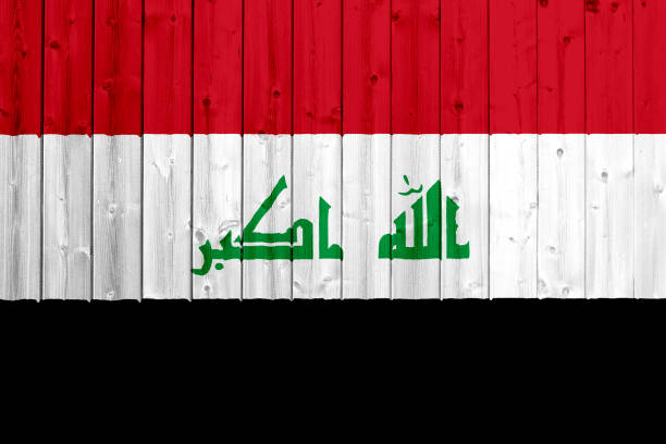 istock Iraq flag with wood texture 694202190