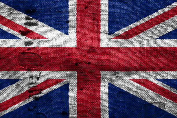 istock Great Britain flag with grunge fabric texture 694202432