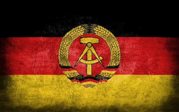 istock East Germany flag with grunge metal texture 694205360
