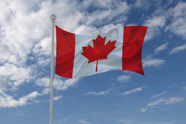 istock Canada flag waving in the sky 694208026