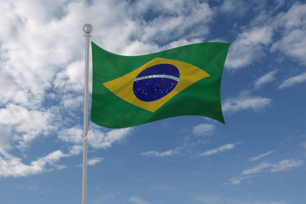 istock Brazil flag waving in the sky 694208036