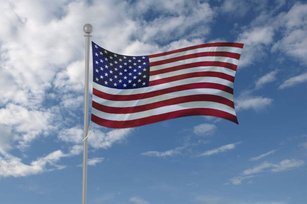 istock USA flag waving in the sky 694208040