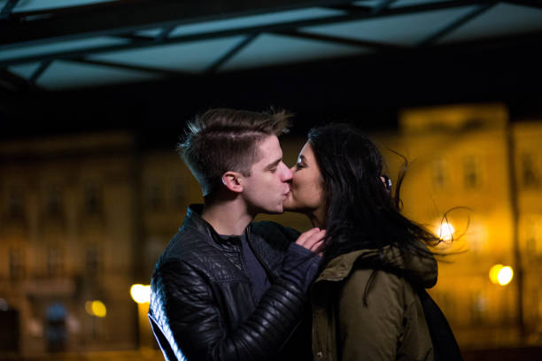 istock Young beautiful couple kissing 694208428