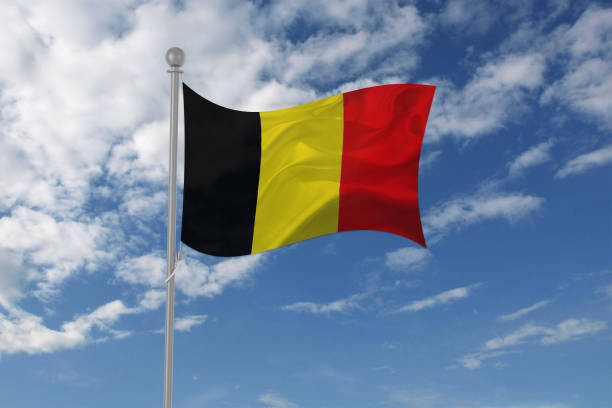 istock Belgium flag waving in the sky 694209598