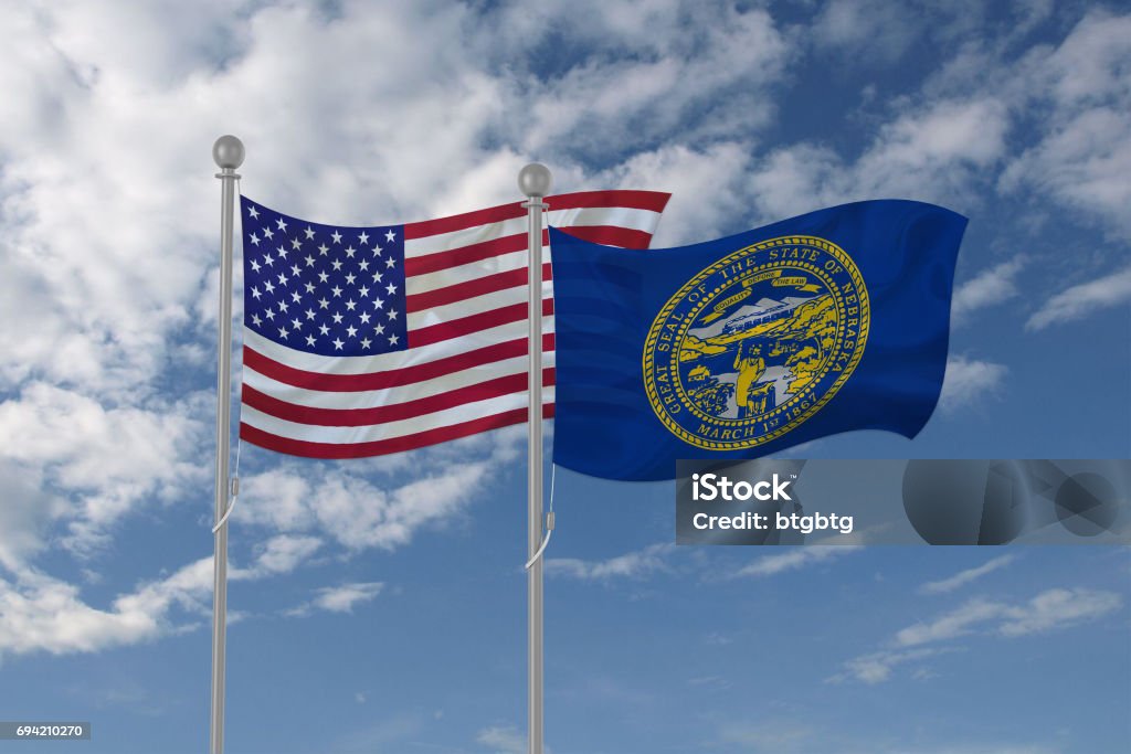 USA and Nebraska flag waving in the sky 3d illustration of national flag waving in the blue sky American Flag Stock Photo