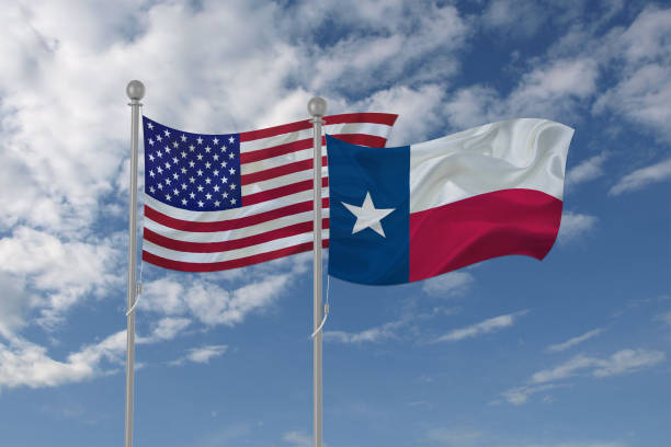 istock USA and Texas flag waving in the sky 694210382