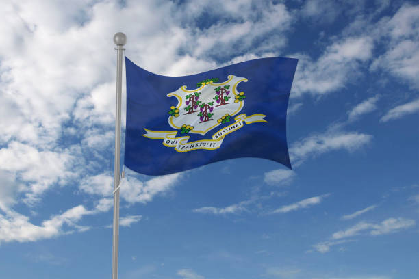 istock Connecticut flag waving in the sky 694210384