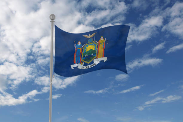 istock New York flag waving in the sky 694210424