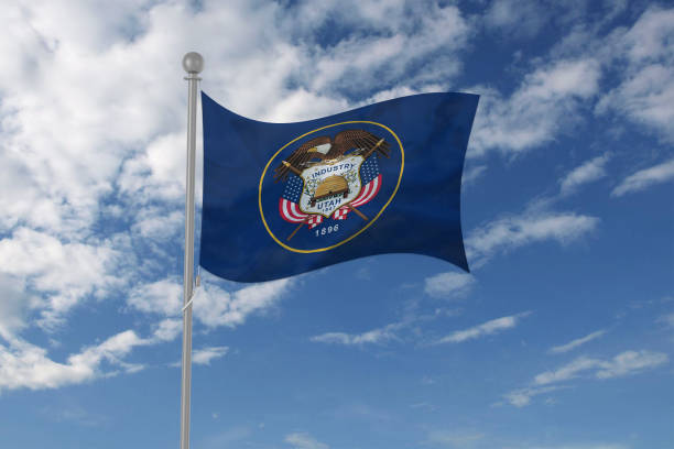 istock Utah flag waving in the sky 694211032
