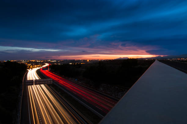 istock Highway Traffic Light Trails and Sunset 694234102