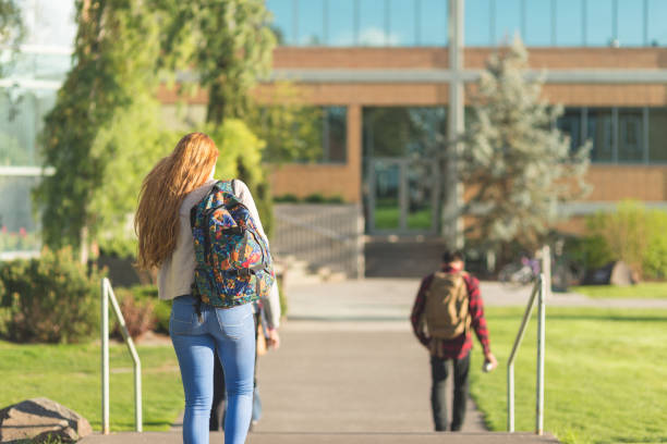 istock Student walks across campus on the way to her next morning class 694237150