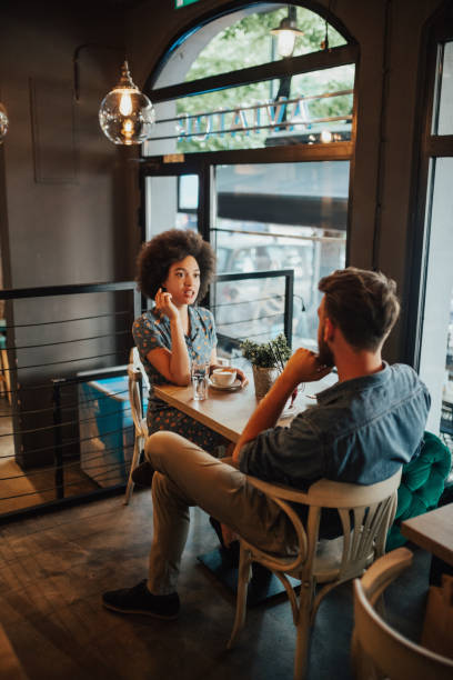istock Childhood friends sat down to drink coffee 694237192