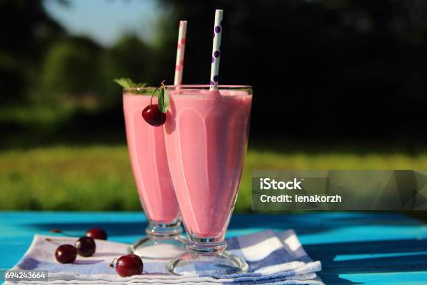 Milkshake With Cherries Stock Photo - Download Image Now - Carbonated, Cherry, Cherry Wood