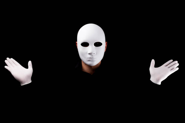 istock Mysterious man with white  mask  and gloves 694244200
