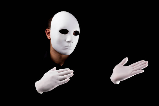 istock Mysterious man with white  mask  and gloves 694244304
