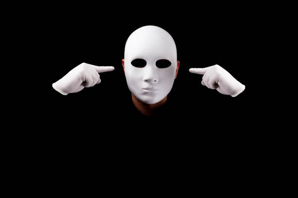 istock Mysterious man with white  mask  and gloves 694244332